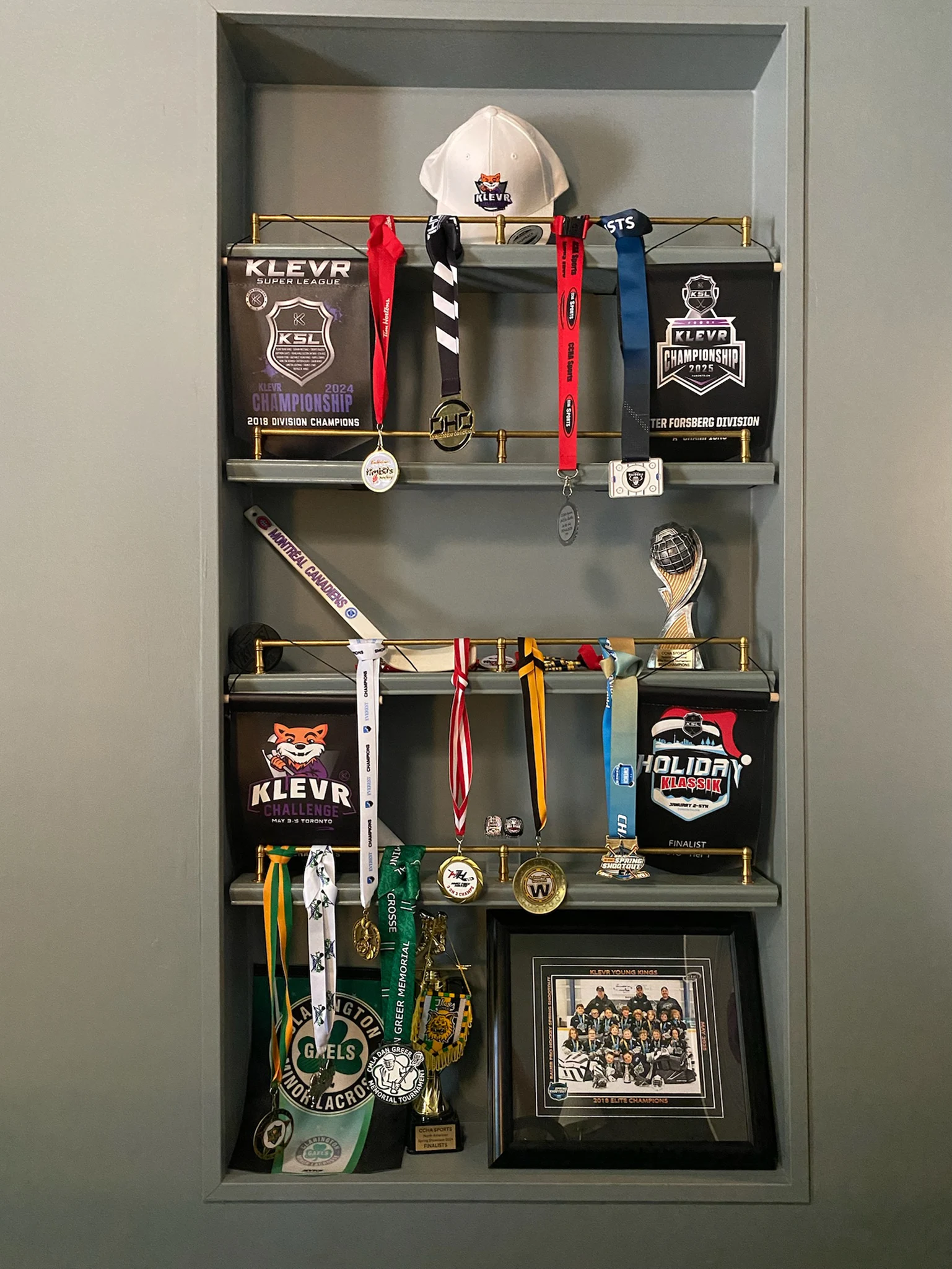 Built-in display niche with medals, banners, trophies, and framed keepsakes