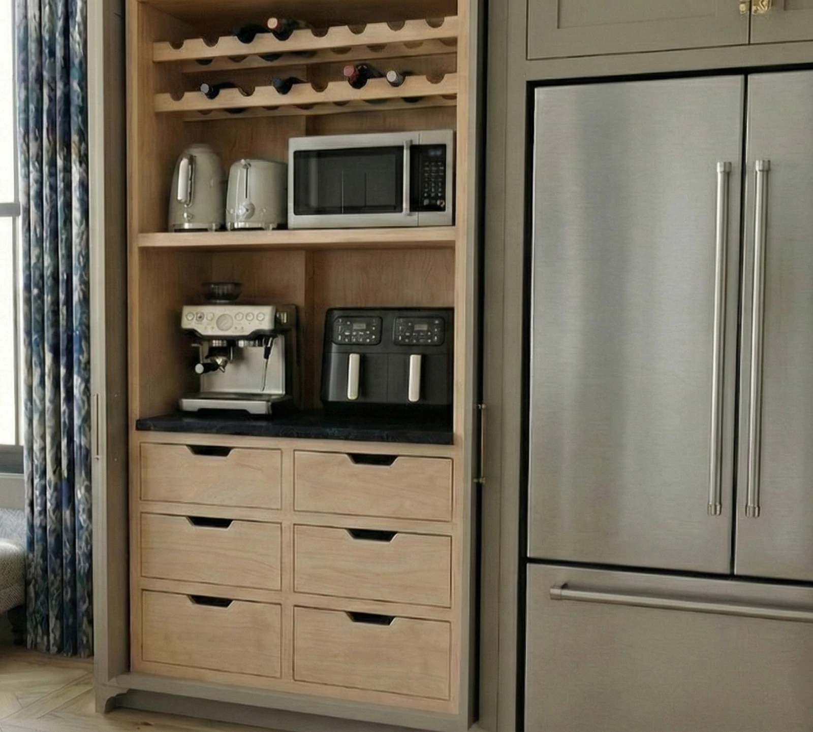 Hidden appliance cabinet rendering beside refrigerator with small appliances and wine storage